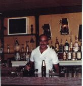 Jim Agatucci behind Agatucci's Pizza bar
